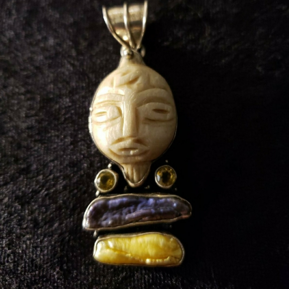 Handcrafted Cream Carved Face Pendant Necklace with Yellow and Purple Accents